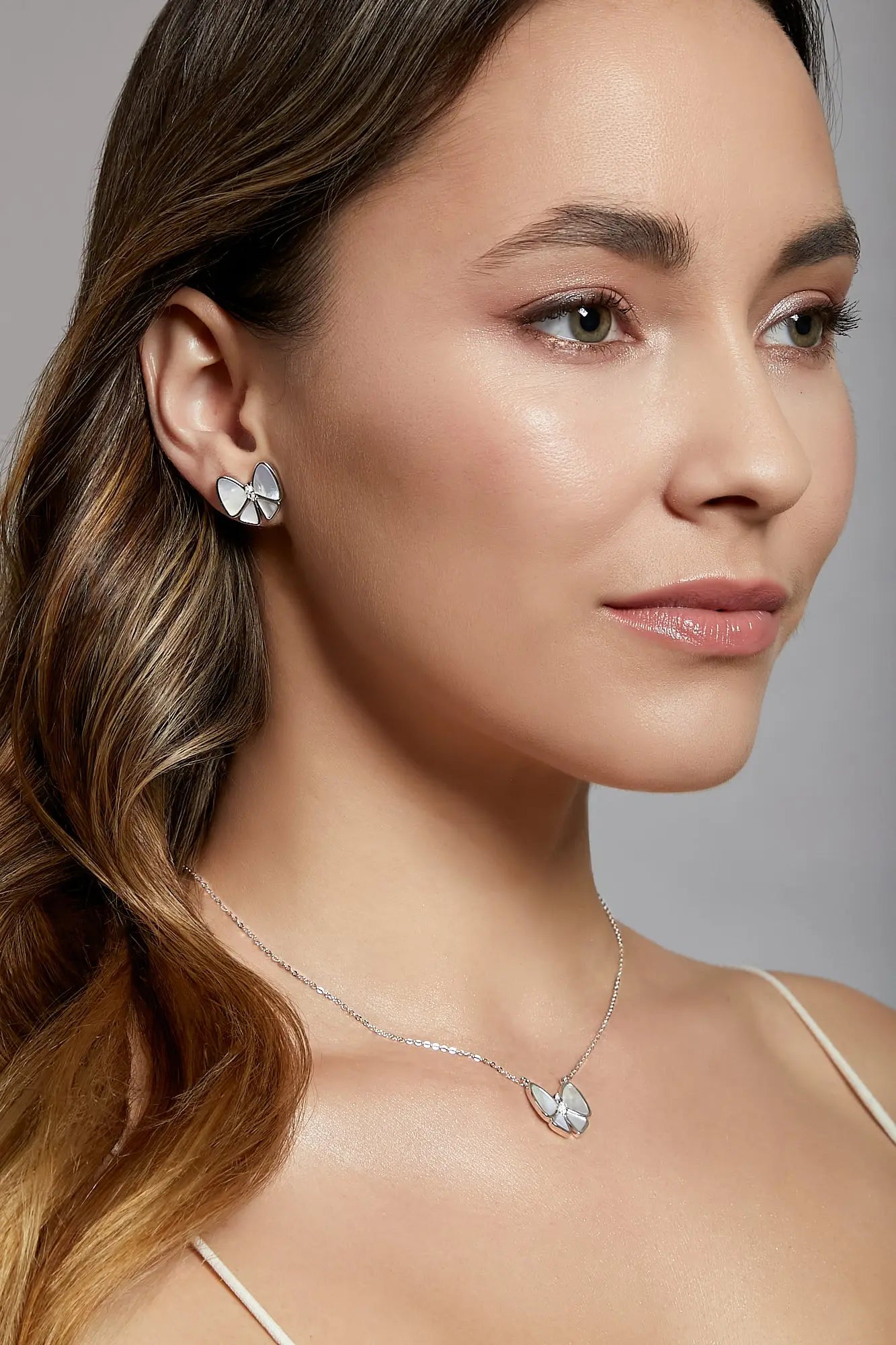 Playful Bow White Mother of Pearl Studs Dryden Jewelry