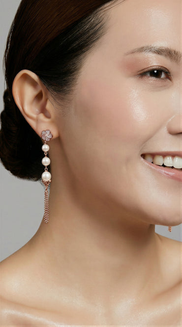 Bauhinia Blakeana Burlesque Rose Gold Dangling Pearl Earrings